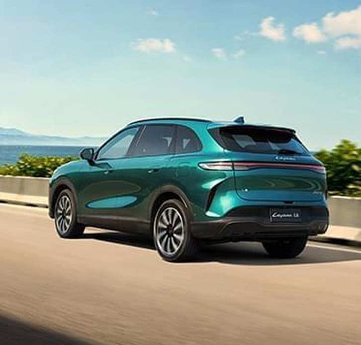Teal LEPAS L8 driving on an open road